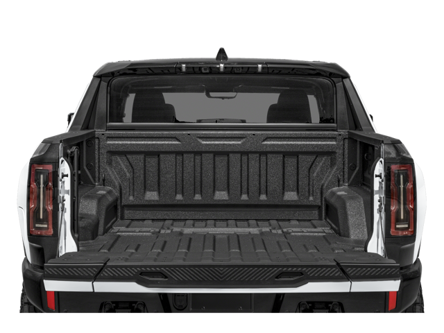 Rear view of 2025 GMC Hummer EV Pickup with open truck bed