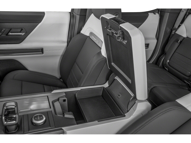 Interior view of 2025 GMC Hummer EV Pickup's open center console and front two seats