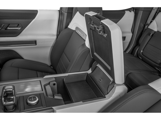 Interior view of 2026 GMC Hummer EV Pickup's open center console and front two seats