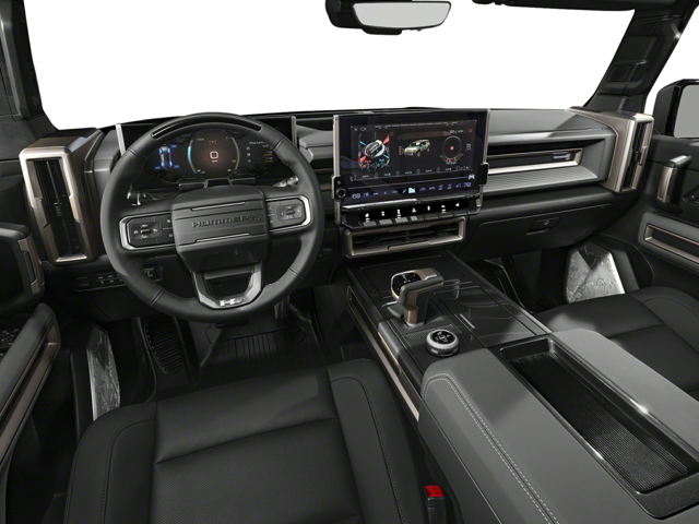 Close up view of 2025 GMC Hummer EV SUV front dashboard from the drivers point of view. Steering wheel, temperature controls, gear shift and touch screen are visible.